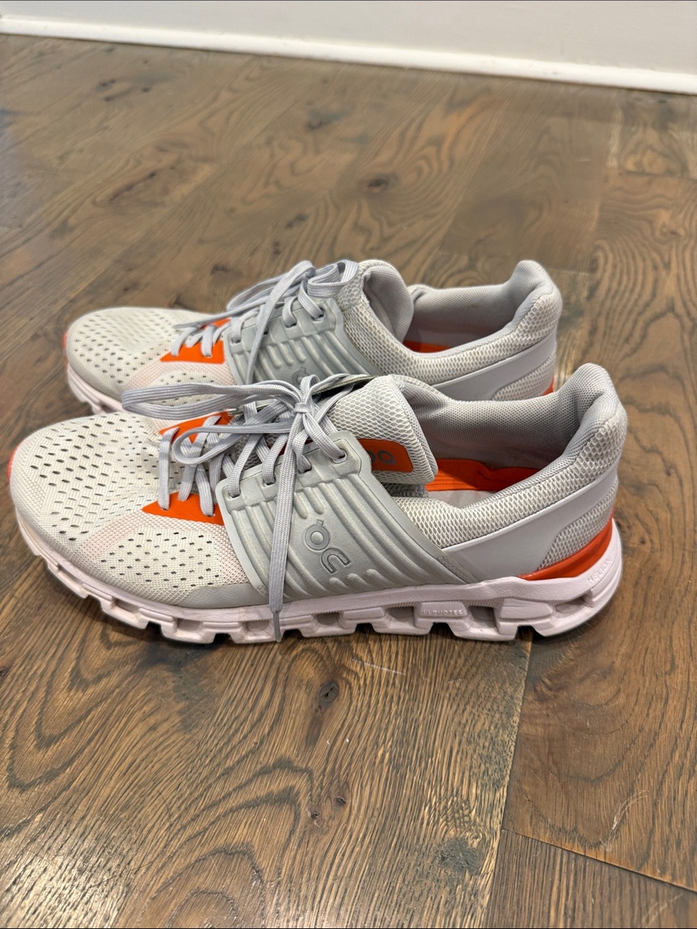 On Running Men's Lightweight Mesh Sneakers in White and Orange